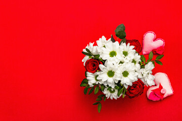 Bouquet of fresh flowers and felt heart for Valentine's day or Wedding
