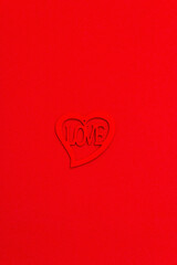 Valentine Day background with carved wooden heart and letters Love