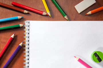 Colored pencils and a drawing pad. The concept of school children's creativity
