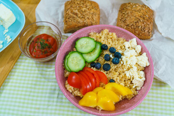 Bulgur porridge with vegetables and sauce top view