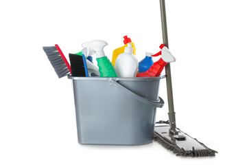 Mop and plastic bucket with different cleaning supplies on white background