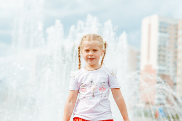 little girl near the fountain