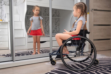 Sweet little girl a disabled child sitting in a wheelchair in her room looking in the mirror and sees herself in a healthy reflection. Concept of children with disabilities in rehabilitation