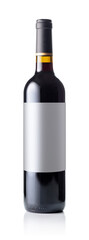 Red wine bottle with empty label isolated on white background.