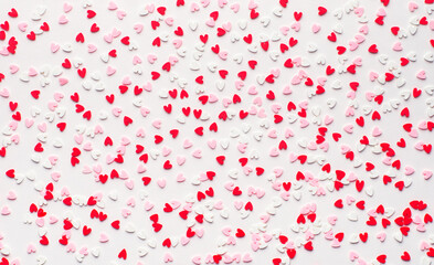 many small colorful hearts background