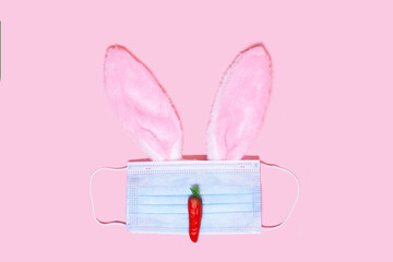Easter bunny made from surgical face mask and decoration, rabbit and carrot. Easter holiday 2021...