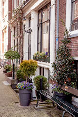 Fototapeta na wymiar Flower filled window boxes. Urban gardening landscaping design. Amsterdam