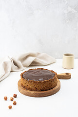 Homemade tofu cake with caramel on a wooden board. Sugar, gluten and lactose free.