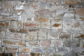 texture of an old stone wall with masonry seams