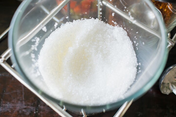 A glass of White Sugar for Thai noodle.