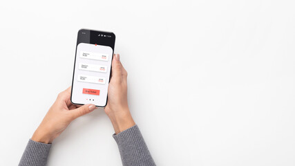 Female Hands Holding Phone Using Application Buying Tickets, White Background