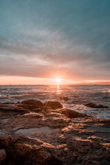 Fototapeta na wymiar Sunset on the beach in Catalonia Long exposure in vertical format