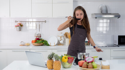 Portrait of beautiful women cooking in the kitchen