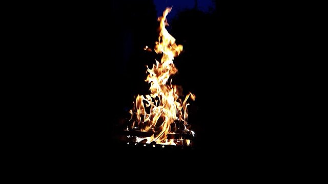 Closeup view of burning bonfire against the background of the night.