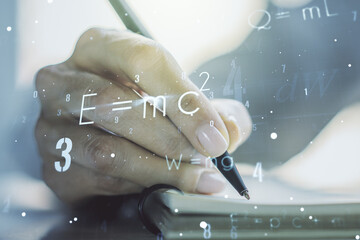 Creative scientific formula illustration with woman hand writing in diary on background, science and research concept. Multiexposure