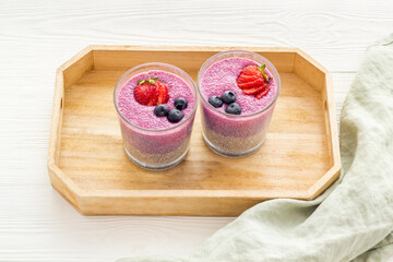 Homemade yogurt chia seeds pudding with strawberries in glasses