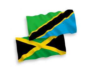 National vector fabric wave flags of Jamaica and Tanzania isolated on white background. 1 to 2 proportion.