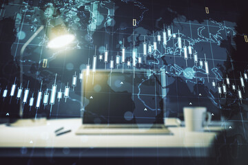 Multi exposure of abstract creative financial chart with world map on laptop background, research and analytics concept