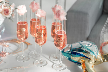 Glasses with champagne in the style of a bachelorette party.
The inscription on the glasses: Bride and Bridesmaids.