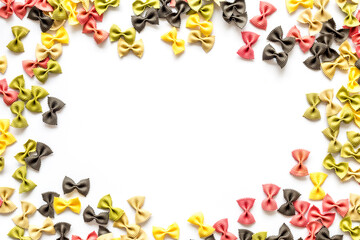Frame of pasta - flay lay of Italian colorful farfalle, top view
