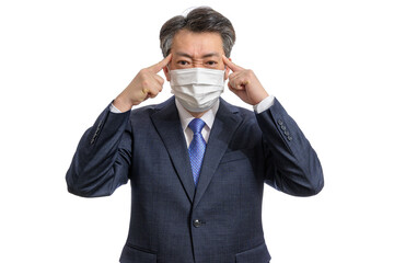 Portrait of a middle-aged Asian businessman wearing a white face mask. White Background. Covid19, Health, and Business Concepts.