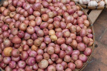 Shallots. Fresh purple shallots on bamboo basket.