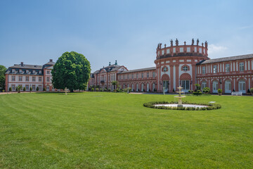 View of the magnificent Biebricher Castle in Wiesbaden / Germany with a fountain in front of it