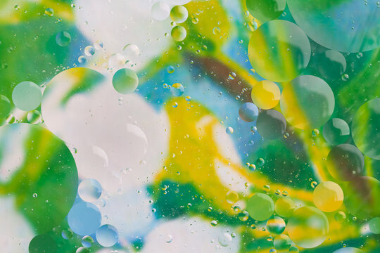 Oil and water bright colorful round bubbles for abstract poster and wallpaper