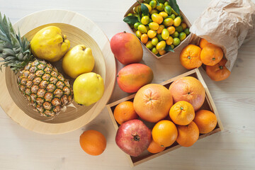 Fruit assorted, exotic and tropical harvest, mango, pineapple, pomegranate, grapefruit, tangerine, orange, kumquat, apple