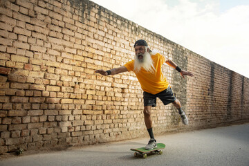 A SENIOR ADULT MAN CHEERFULLY SKATING ON ROAD	
