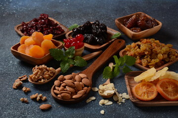 Mix of dried and sun-dried fruits,  in a wooden trays . View from above. Symbols of the Jewish holiday of Tu BiShvat