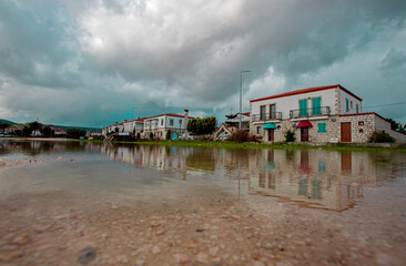 Turkey -Izmir -15 January 2021 Alaçatı street photos, reflections in rainwater.