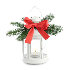 Decorative Christmas lantern with bow and coniferous twigs isolated on white