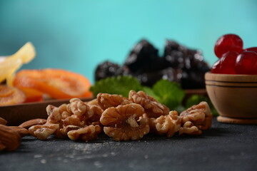 Mix of dried and sun-dried fruits,  in a wooden trays . View from above. Symbols of the Jewish holiday of Tu BiShvat