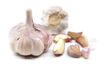 Garlic for healthy eating. Fresh organic garlic cloves and garlic bulb isolated on a white background. Closeup