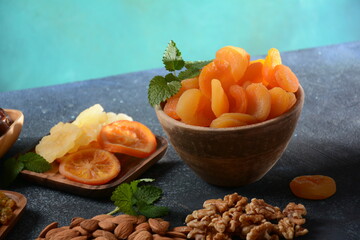 Mix of dried and sun-dried fruits,  in a wooden trays . View from above. Symbols of the Jewish holiday of Tu BiShvat