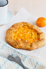 Galetta. Open fruit cake with mandarins