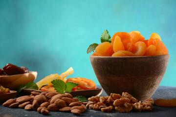 Mix of dried and sun-dried fruits,  in a wooden trays . View from above. Symbols of the Jewish holiday of Tu BiShvat