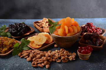 Mix of dried and sun-dried fruits,  in a wooden trays . View from above. Symbols of the Jewish holiday of Tu BiShvat