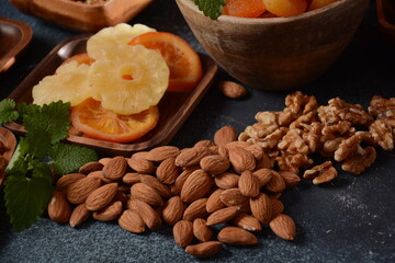 Mix of dried and sun-dried fruits,  in a wooden trays . View from above. Symbols of the Jewish holiday of Tu BiShvat