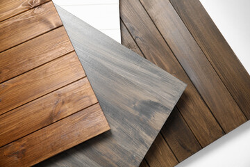 Different wooden surfaces for photography on white background, top view