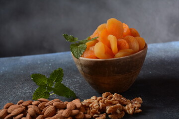 Mix of dried and sun-dried fruits,  in a wooden trays . View from above. Symbols of the Jewish holiday of Tu BiShvat