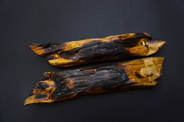 Pepes ikan is a type of traditional Javanese cuisine isolated on a black background.
