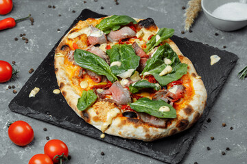 Meat Italian pizza with roast beef, steak slices, melted cheese, with olive slices and cheddar cheese. Close up, macro. Pizza time concept