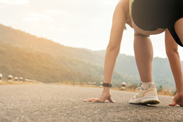 gril running on empty road in morning.