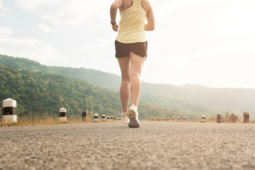 Empty road with running girl in background