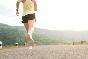 Empty road with running girl in background