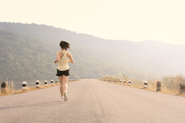 Empty road with running girl in background