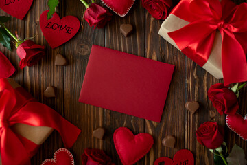 Postcard with gift boxes, hearts and roses on wooden background. Valentines, mothers day and...