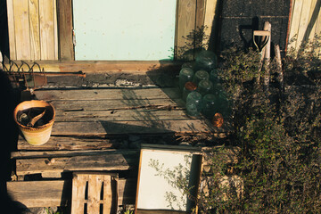 Old abandoned and rotten porch with jars and other things.